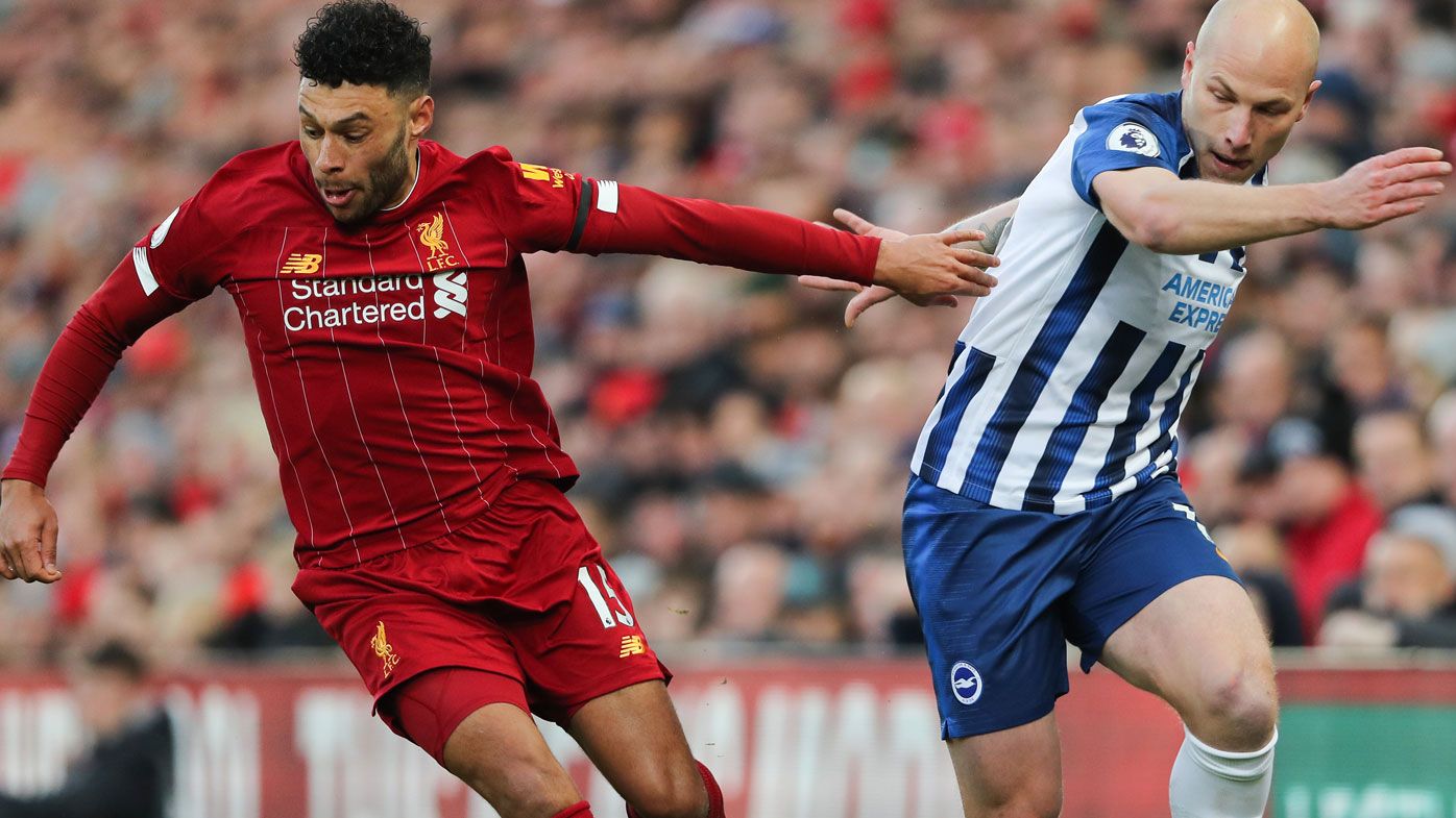 Alex Oxlade-Chamberlain of Liverpool and Aaron Mooy of Brighton and Hove Albion
