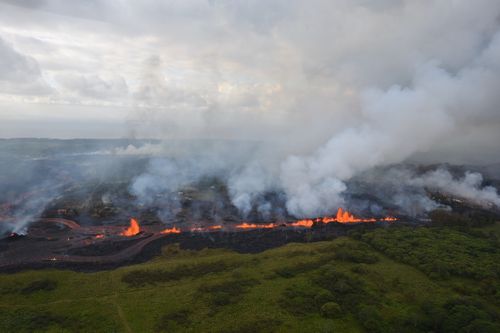 An aerial photo released by the US Geological Survey shows lava fountains from Fissure 20 in Kilauea volcano's lower East Rift Zone. (AAP)