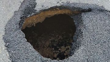 Police warn residents to be wary of sink hole on Murray Street in Gawler in South Australia. 