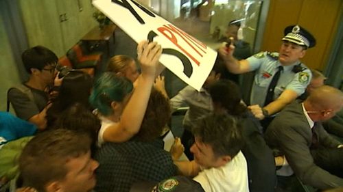 Ugly scenes outside the lecture hall. (9NEWS)