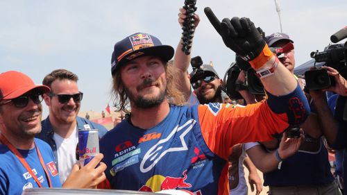 Toby Price celebrates his second Dakar Rally win.