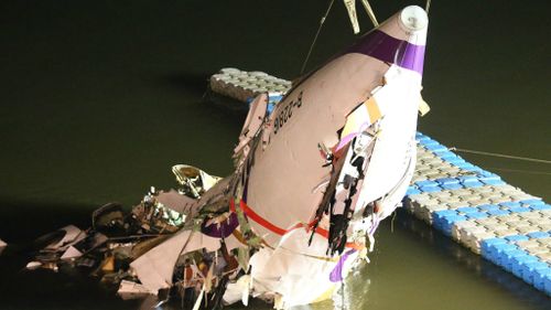 Rescuers worked into the night to retrieve the plane. (AAP)