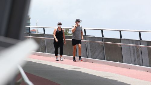 Local residents exercise near Southbank, towards the end of Brisbane's three-day lockdown.