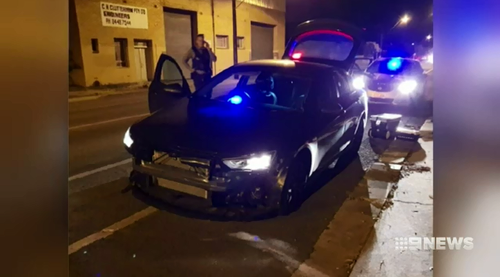 A police car was rammed up to eight times as the car thieves escaped.