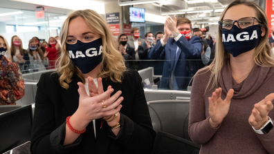 Campaign workers applaud after President Donald Trump speaks at the Trump campaign headquarters on Election Day, Tuesday, Nov. 3, 2020, in Arlington, Va. (AP Photo/Alex Brandon)