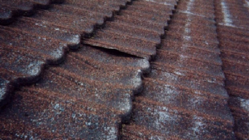 Hazmat says some versions of mastic or bitumen-based pressed metal roof tiles produced prior to the early 1980s contain asbestos.