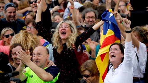 Crowds celebrate outside Catalonia's parliament as the region declares independence from Spain. (AAP)