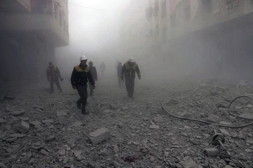Civil defence workers search for survivors after airstrikes. (Syrian Civil Defense White Helmets via AP)
