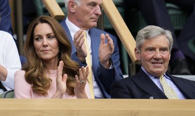 Kate, Duchess of Cambridge sits in the Royal Box with her father Michael Middleton to watch the men's singles final between Serbia's Novak Djokovic and Italy's Matteo Berrettini on day thirteen of the Wimbledon Tennis Championships in London, Sunday, July 11, 2021. (AP Photo/Kirsty Wigglesworth)