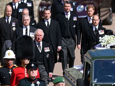 The royal family walk in procession behind Prince Philip's coffin