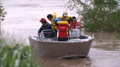 A number of vessels had been on the Burdekin River yesterday when one boat crashed into a submerged jetty - knocking a number of men into the water.