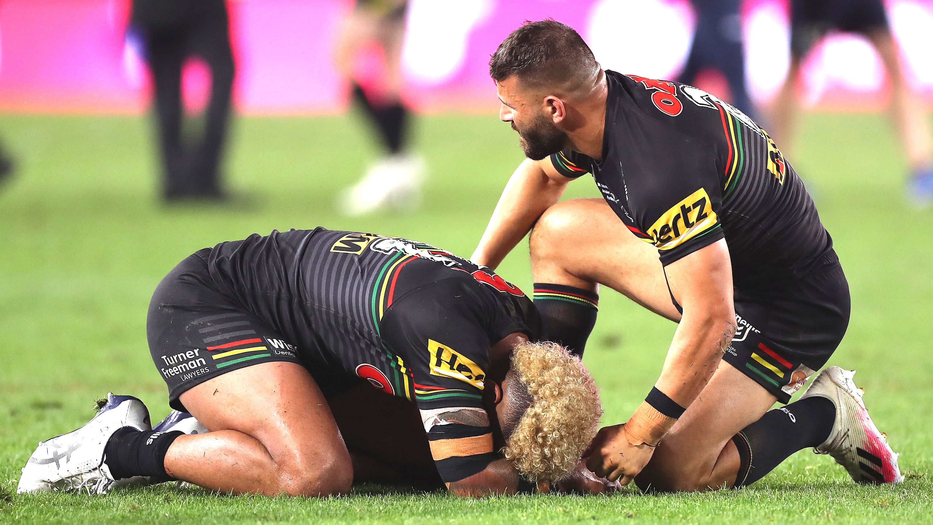Viliame Kikau is comforted by Josh Mansour.