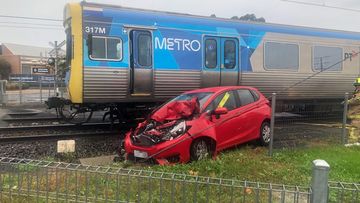 The car was struck at the Warrigal Road level crossing in Mentone.