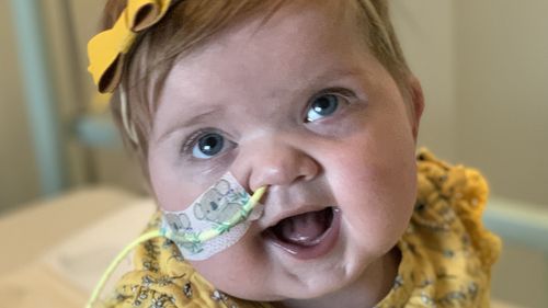 Millie Robinson, two, was born with a serious heart condition which means she has 'half a heart' and multiple other related problems.
