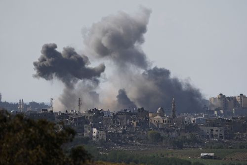Smoke rises following an Israeli airstrike in the Gaza Strip, as seen from southern Israel, Wednesday, Oct. 18, 2023. 