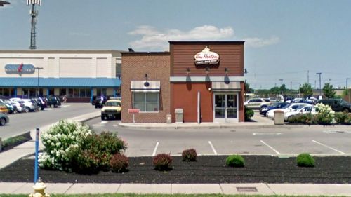 The boy fell into the grease trap embedded in the ground outside a Tim Hortons restaurant.