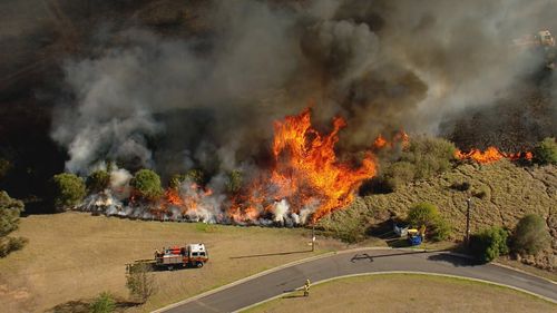 Resident's Sydney's south-west are being warned to monitor conditions as a grass fire burns out of control.