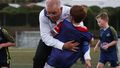Prime Minister Scott Morrison accidentally knocks over a child during a visit to the Devonport Strikers Soccer Club, which is in the electorate of Braddon in Devonport, Australia. 