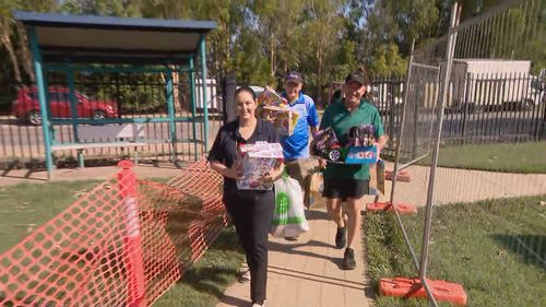 Locals and businesses donating hundreds of presents under the tree for flood-affected children, including soccer balls, skateboards, drones and gift vouchers among the haul.