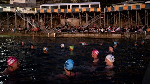 Swimmers brave the icy conditions at Wylie's Baths at Coogee Beach, on the coldest June morning since 2010.