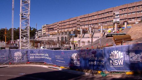 A man has died after he became trapped on the site of the John Hunter Hospital redevelopment in Newcastle.
