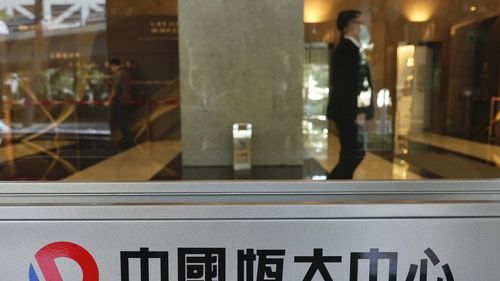 A security guard at the headquarters of China Evergrande Group in Hong Kong in October.