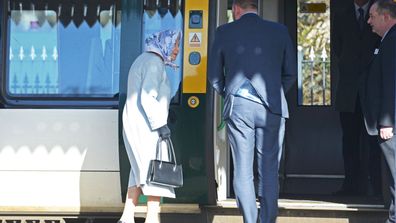 Queen Elizabeth II walks alongside station manager Graeme Pratt as she arrives at King's Lynn railway station in Norfolk, ahead of boarding a train as she returns to London after spending the Christmas period at Sandringham House in north Norfolk.