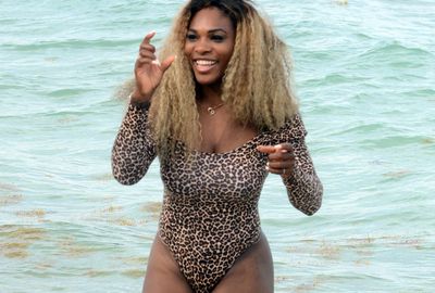 <b>Serena Williams appears to be over her French Open exit after turning heads in a revealing animal-print cossie while hanging out with Caroline Wozniaki at a Miami beach. </b><br/><br/>The world No1 left little to the imagination as she enjoyed herself with fellow Roland Garros flop Wozniaki, who recently split with her Irish fianc&eacute;, golfer Rory McIlory. <br/><br/>Williams even crashed a nearby wedding party, posing for photos with the happy bride and groom in her risque outfit.
