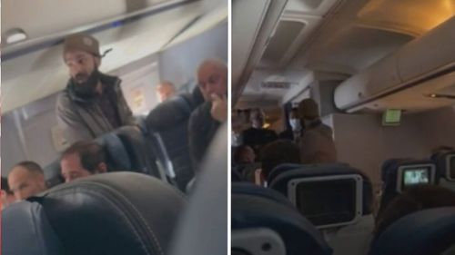 Passenger restrained on flight between Los Angeles and Boston after trying to stab flight attendant. 