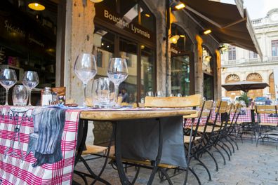 "Lyon, France - July 6, 2012: Empty outdoors of a Bouchon Lyonnais, a traditional restaurant which serves typical regional dishes."