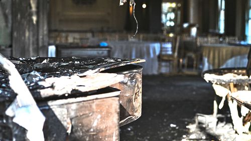 A charred piano, left, is visible inside the Pennsylvania governor's official residence after a man was arrested in the alleged arson that forced Gov. Shapiro, his family and guests to flee in the middle of the night on the Jewish holiday of Passover, Sunday, Apr. 13, 2025, in Harrisburg, Pa. (AP Photo/Marc Levy)