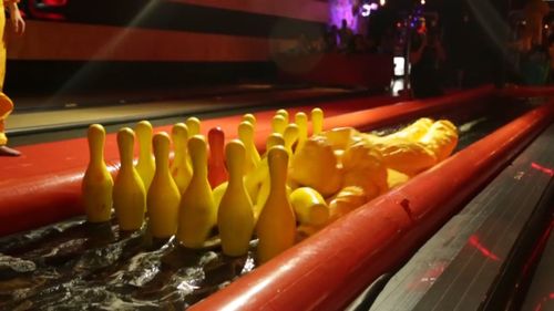 Competitors will be given a special suit and helmet, oil themselves up and need to slide down a makeshift bowling alley in the most creative or stylish way to knock down pins (Supplied).