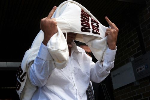 Jai Abberton gestures to the media as he leaves Waverley Court in 2006. (AAP)