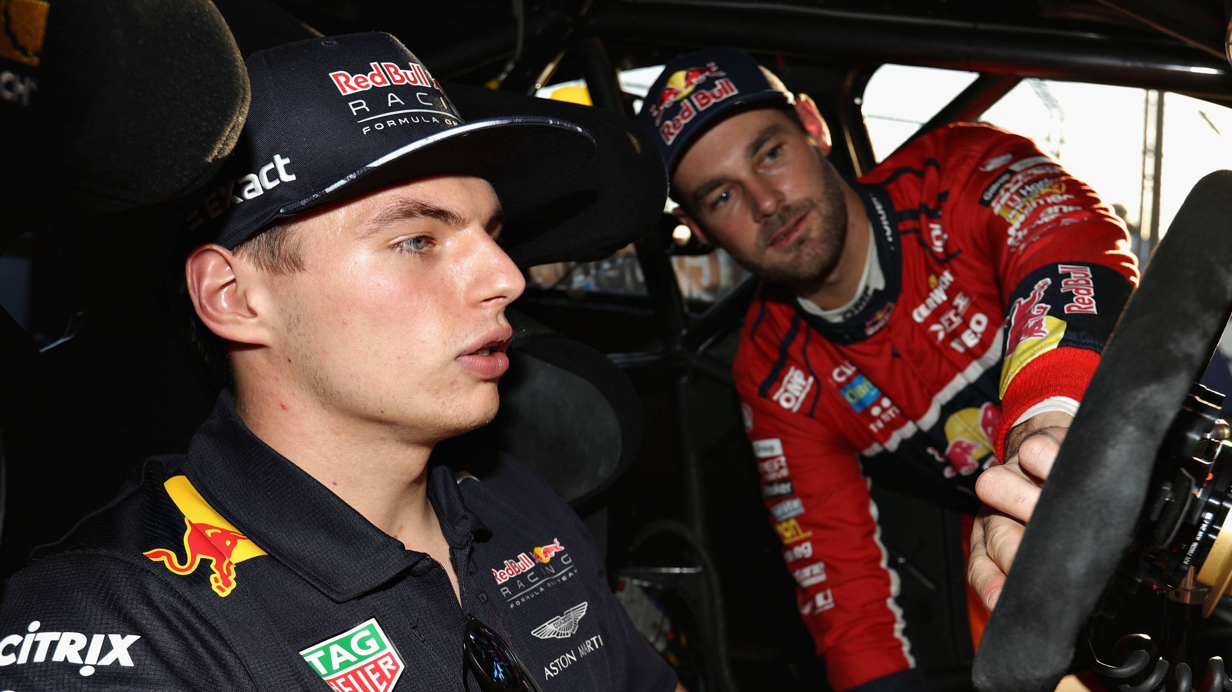 Max Verstappen (left) Racing talks with Supercar driver Shane Van Gisbergen during the 2017 Formula 1 Australian Grand Prix.