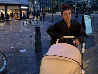 Millie Bobby Brown pushing her daughter in a pram