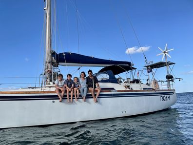 Erin Carey and her family on their sailboat.