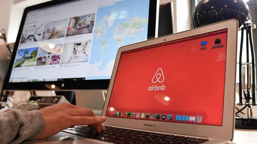 16 April 2018, Germany, Berlin: Airbnb's logo can be seen on different screens in Airbnb Germany GmbH's office in the Neue Schoenhauser Street. Airbnb is a community marketplace for people to book and rent accommodations Private and commercial lessors rent apartments with the support of agencies. Photo: Jens Kalaene/dpa-Zentralbild/dpa (Photo by Jens Kalaene/picture alliance via Getty Images)
