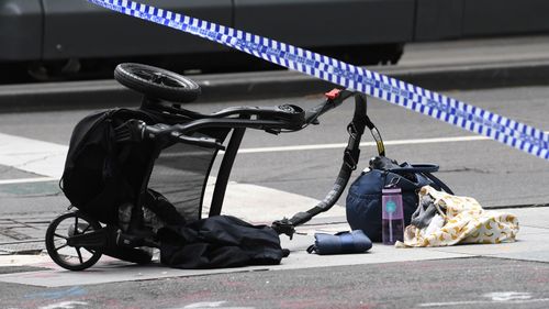 The upturned pram after it was struck by the car on Bourke Street. (AAP)