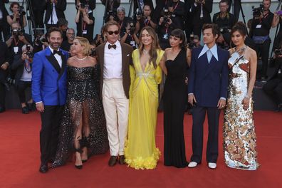 Don't Worry Darling cast, Gemma Chan, from right, Harry Styles, Sydney Chandler, director Olivia Wilde, Chris Pine, Florence Pugh and Nick Kroll poses for photographers upon arrival at the premiere of the film 'Don't Worry Darling' during the 79th edition of the Venice Film Festival in Venice, Italy, Monday, Sept. 5, 2022. (Photo by Joel C Ryan/Invision/AP)