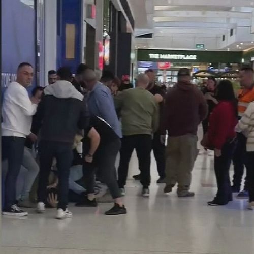 A ﻿30-year-old man has been arrested after allegedly threatening two people with a knife at a shopping centre in Melbourne's west today.