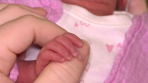 The identical triplet sisters are receiving medical care at Townsville Hospital. (9NEWS)