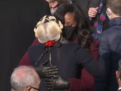 Michelle Obama and Lady Gaga hug at Joe Biden's inauguration