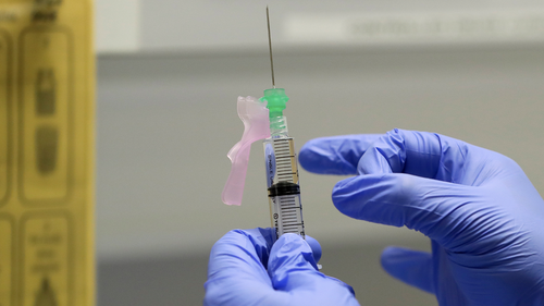 Senior Clinical Research Nurse Ajithkumar Sukumaran prepares the COVID 19 vaccine to administer to a volunteer, at a clinic in London. 