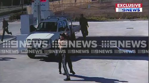 The vision obtained exclusively by 9NEWS shows the man running from police after an alleged car  chase before appearing to surrender.