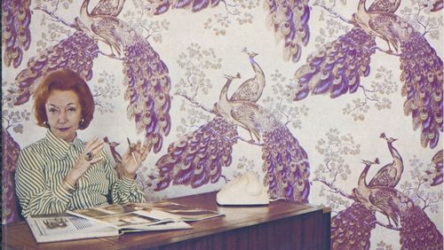 Designer Florence Broadhurst in the 1960s with her peacock wallpaper. 