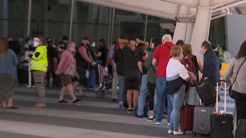 Travellers have had to wait in long COVID-19 testing queues at Adelaide Airport overnight.