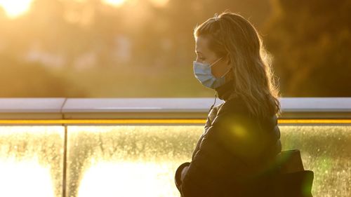 A woman in Adelaide wears a mask during a snap lockdown of South Australia.