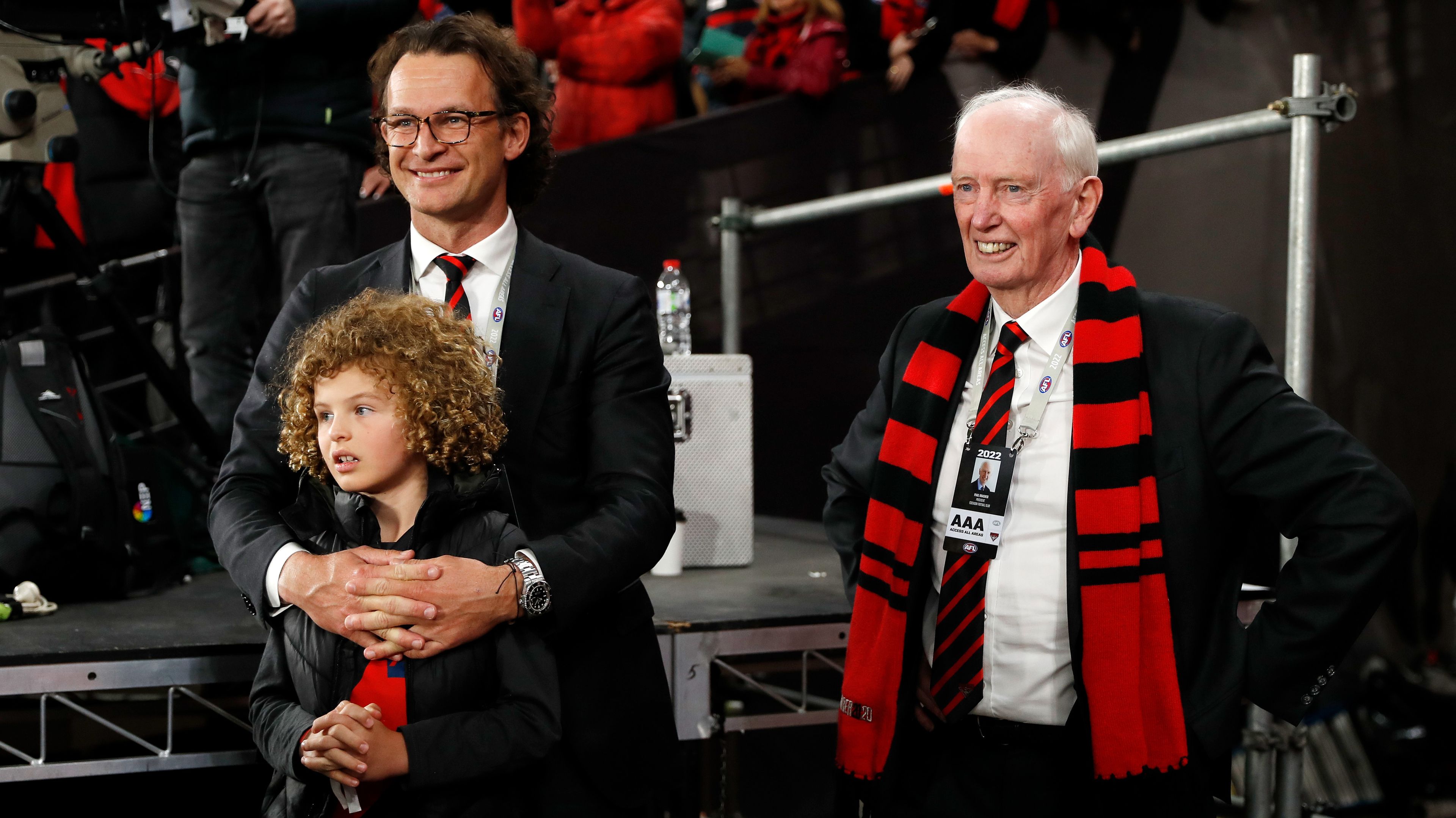 Former Essendon CEO Xavier Campbell and club president Paul Brasher stand together.