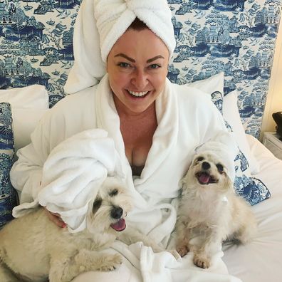 Shelly Horton in bed with her dogs