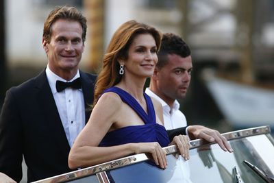 Supermodel status! <br/><br/>Cindy Crawford and hubby Rande Gerber take their water taxi to the star-studded wedding.